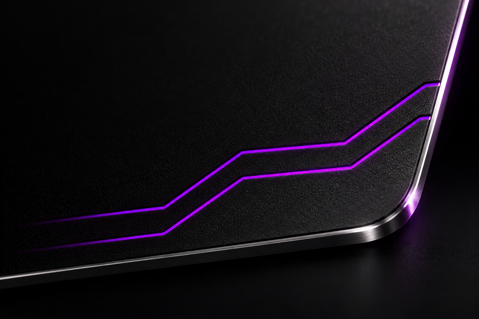 Close-up of the GhostCard’s matte black surface, metallic edge and electric violet detail